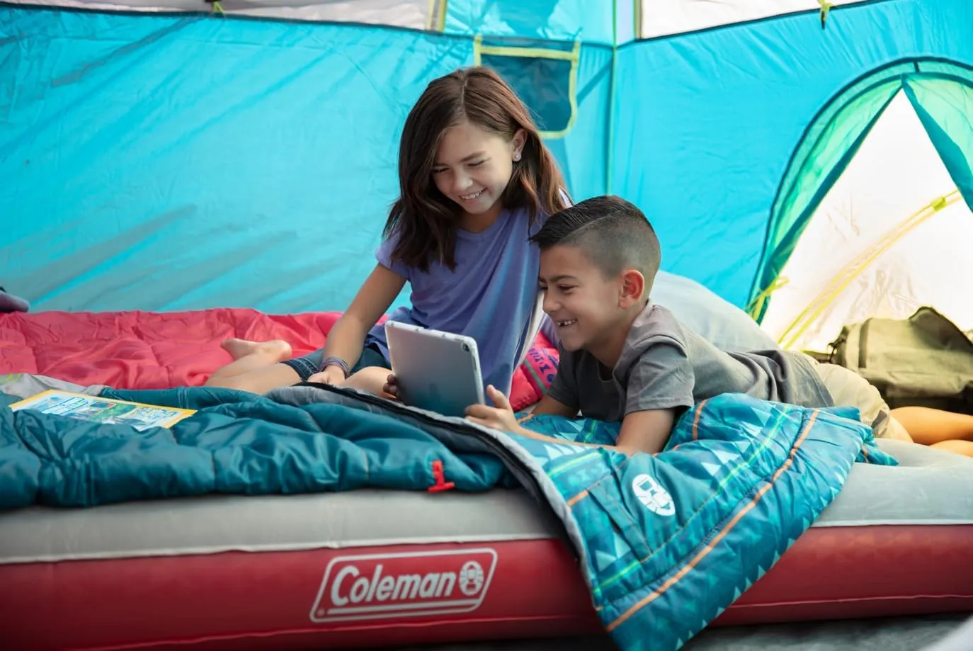 Coleman Kids 50°F Sleeping Bag for Children up to 5ft Tall, Comfortable Youth Sleeping Bag for Sleepovers & Camping, Glow in The Dark Design, Stuff Sack Included, Machine Washable