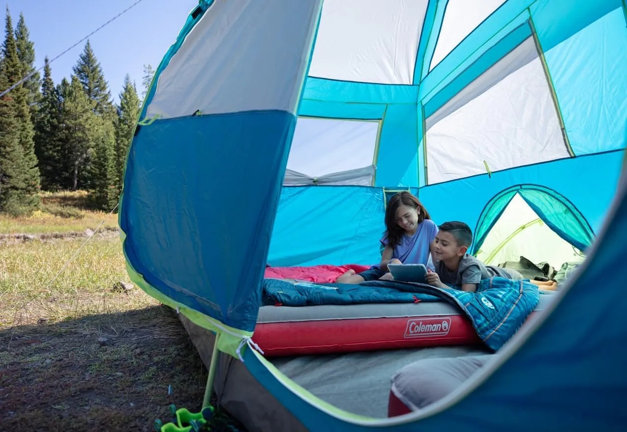 Coleman Kids 50°F Sleeping Bag for Children up to 5ft Tall, Comfortable Youth Sleeping Bag for Sleepovers & Camping, Glow in The Dark Design, Stuff Sack Included, Machine Washable